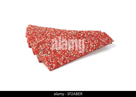 Beetroot crackers isolated, thin rusk beet root bread, red diet multigrain crispbread, various seeds whole grain crisp bread, long cracker on white ba Stock Photo