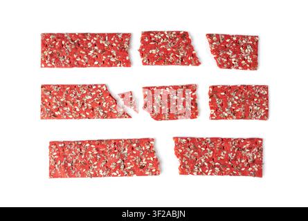 Beetroot crackers pieces isolated, crumbled thin rusk beet root bread pile, broken red diet multigrain crispbread Stock Photo