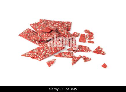 Beetroot crackers pieces isolated, crumbled thin rusk beet root bread pile, broken red diet multigrain crispbread with various seeds, crisp bread, lon Stock Photo