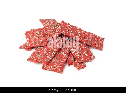Beetroot crackers pieces isolated, crumbled thin rusk beet root bread pile, broken red diet multigrain crispbread with various seeds, crisp bread, lon Stock Photo