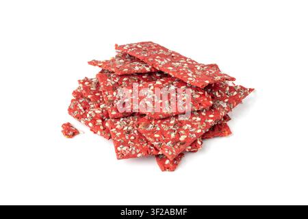 Beetroot crackers pieces isolated, crumbled thin rusk beet root bread pile, broken red diet multigrain crispbread with various seeds, crisp bread, lon Stock Photo
