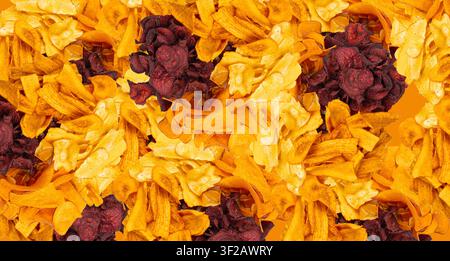Parsnips, sweet potato, carrot and beetroot chips wallpaper, dry vegetable root mix, healthy snacks pile pattern top view Stock Photo
