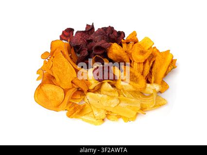 Parsnips, sweet potato, carrot and beetroot chips isolated, dry vegetable root mix, healthy snacks pile on white background Stock Photo