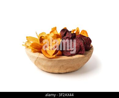 Parsnips, sweet potato, carrot and beetroot chips isolated, dry vegetable root mix, healthy snacks pile in wood bowl on white background Stock Photo