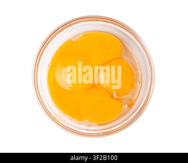 Egg Yolks in Bowl, 4 Fresh Chicken Egg Yolk Separated from Whites for Cooking Recipe, Four Organic Yolks in Glass Bowl Stock Photo