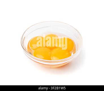 Egg Yolks in Bowl, 5 Fresh Chicken Egg Yolk Separated from Whites for Cooking Recipe, Five Organic Yolks in Glass Bowl Stock Photo