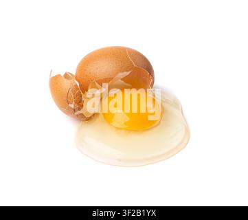 Broken Egg Isolated, Raw Yolk and White, Cracked Brown Shell, Fresh Broken Organic Chicken Eggs on White Background Stock Photo