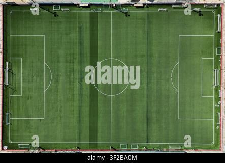 Aerial view of Melita Football Club pitch in Pembroke, Malta, with goalposts, synthetic turf and geometric field markings on an empty modern sports fa Stock Photo