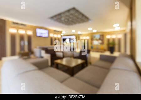Blurred photo of hotel lobby with big heart corner sofa Stock Photo