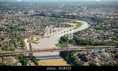 Aerial view of the Juan Bosch Bridge spanning the Ozama River with ...