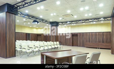 View from table for speaker to audience with chairs Stock Photo