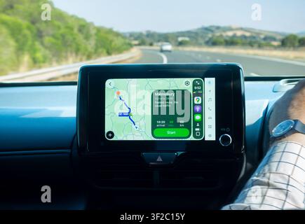 Apple CarPlay with Apple Maps screen Toyota dashboard infotainment system driving on the M79 freeway in Victoria Australia from Melbourne to Malmsbury Stock Photo