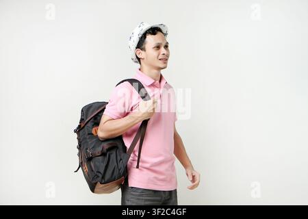 Asian man backpacker portrait. digital nomad and travelling concept. on isolated background Stock Photo