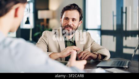 Laptop, discussion and business men in office for finance report with budget planning in collaboration. Computer, meeting and financial advisor with Stock Photo