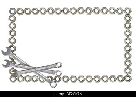 A frame of iron nuts and wrenches on a white background. Horizontal frame of nuts and wrenches. Stock Photo