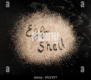 Broken Egg Shell Isolated, Crushed Eggshell, Calcium Supplement, Cracked Eggshells, Natural Compost Ingredient, Broken Egg Shells Pile on Black Backgr Stock Photo