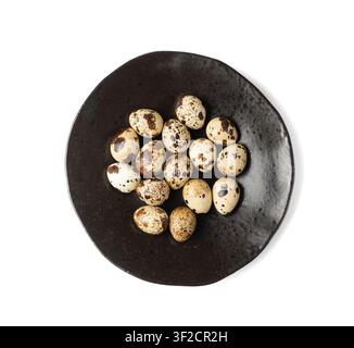 Quail Eggs Isolated, Diet Egg on Black Plate, Healthy Breakfast, Natural Organic Nutrition, Salad Ingredient Spotted Quail Egg on White Background Stock Photo