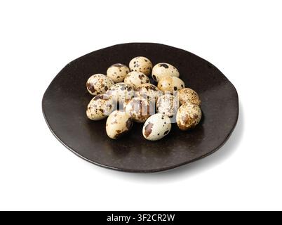 Quail Eggs Isolated, Diet Egg on Black Plate, Healthy Breakfast, Natural Organic Nutrition, Salad Ingredient Spotted Quail Egg on White Background Stock Photo