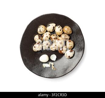 Quail Eggs Isolated, Diet Egg on Black Plate, Healthy Breakfast, Natural Organic Nutrition, Salad Ingredient Spotted Quail Egg on White Background Stock Photo
