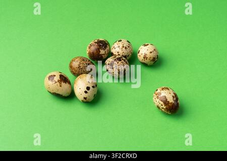 Quail Eggs, Diet Egg Group, Healthy Breakfast, Natural Organic Nutrition, Salad Ingredient Spotted Quail Egg on Green Background Stock Photo