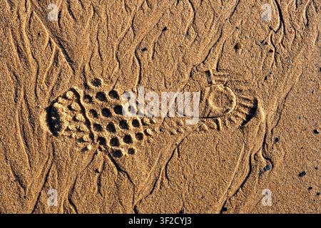 Shoe prints in the sand Stock Photo