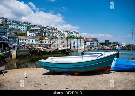 Small fishing boat on the slipway overlooking Brixham Harbour and the Golden Hind replica in Devon, England. Stock Photo
