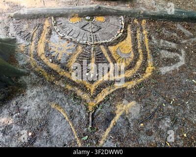 Shamanistic Land Art in Forest Floor - Nature Artwork Made from Stones and Branches. High quality photo Stock Photo
