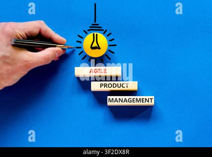 Agile product management words symbol. Concept words Agile product management on beautiful wooden blocks. Beautiful blue background. Business agile pr Stock Photo