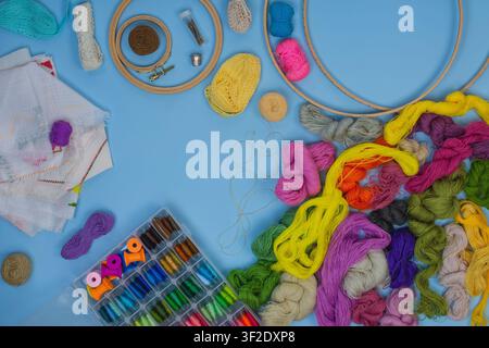 Trendy  set of tools for embroidery. Flat lay composition. Composition with embroidery and different accessories. Stock Photo
