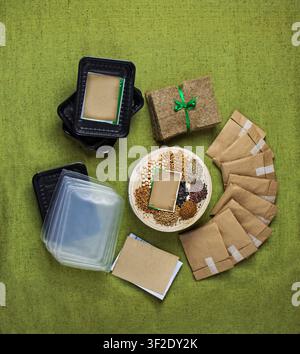 Wooden round plate at center displays seed varieties in separate portions showing full range of included species. Stack of natural jute sprouting mats Stock Photo