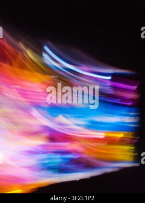Creative blur bokeh vivid rainbow blurred background. Abstract glitters rainbow sky with bokeh on black Stock Photo