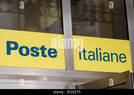Poste Italiane Yellow Sign on the Glass Entrance Facade in Ital window of facade office logo. Milan, Italy - June 24, 2026 Stock Photo