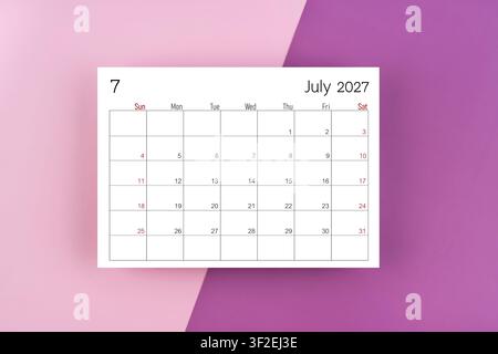 July 2027 blank calendar page on purple two tone color background. Stock Photo