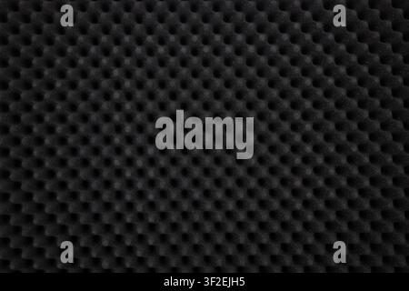 Black acoustic foam texture pattern for soundproofing background. Stock Photo