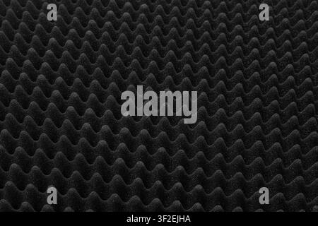 Black acoustic foam texture pattern for soundproofing background. Stock Photo
