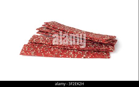 Beetroot crackers isolated, thin rusk beet root bread, red diet multigrain crispbread, various seeds whole grain crisp bread, long cracker on white ba Stock Photo