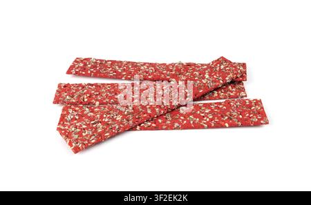 Beetroot crackers isolated, thin rusk beet root bread, red diet multigrain crispbread, various seeds whole grain crisp bread, long cracker on white ba Stock Photo