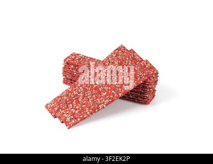 Beetroot crackers isolated, thin rusk beet root bread, red diet multigrain crispbread, various seeds whole grain crisp bread, long cracker on white ba Stock Photo