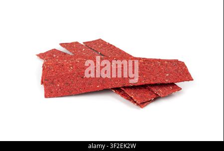 Beetroot crackers, thin rusk beet root bread, red diet multigrain crispbread, various seeds whole grain crisp bread, long cracker with sesame, sunflow Stock Photo