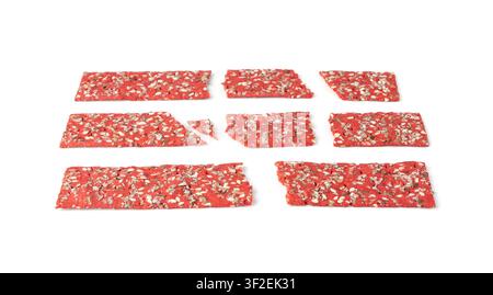 Beetroot crackers pieces isolated, crumbled thin rusk beet root bread pile, broken red diet multigrain crispbread with various seeds, crisp bread, lon Stock Photo