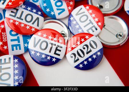 Red, white, and blue vote buttons on background Stock Photo