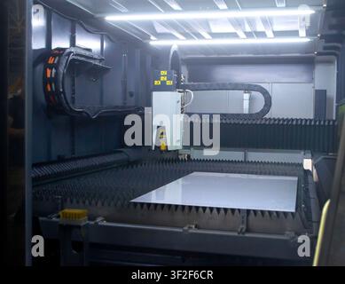 Industrial fiber laser cutting machine for metal, high-precision sheet metal processing. Laser metal processing. Laser machine. Industry. Industrial machine. Industrial background Stock Photo