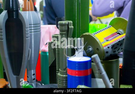 Models of various types of weapons, with RGN hand grenade printed on 3D printer. Prototype of ammunition printed on 3D printer. Innovation new modern additive technologies. 3D printing technology Stock Photo