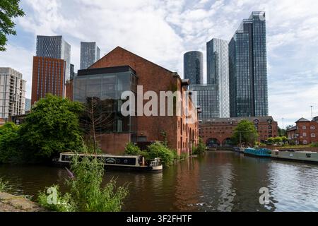 Modern apartment buildings seen from the Bridgewater canal at Castlefield in the city of Manchester, Northwest England. Stock Photo