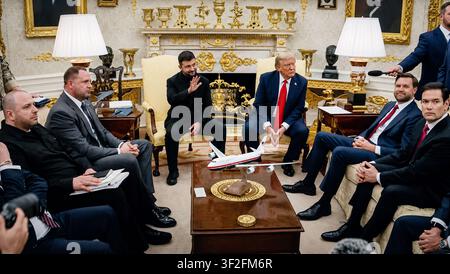 President Zelenskyy, President Trump, with Senator Marco Rubio, and Vice President JD Vance (amongst others) seated in the Oval Office taking questions from the press corps, August 17, 2025 Stock Photo