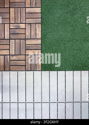 Wood deck tiles artificial grass and white composite flooring arranged as outdoor material samples Stock Photo
