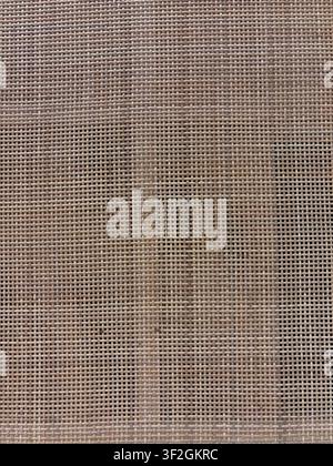 Woven cane webbing texture in warm natural beige for furniture and interior backgrounds Stock Photo