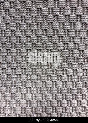 Gray and beige geometric woven carpet texture with repeating square loops and textile pattern Stock Photo