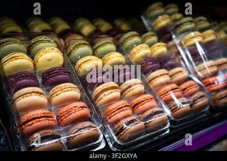 Close view of cases of multicolored macaron cookies Stock Photo