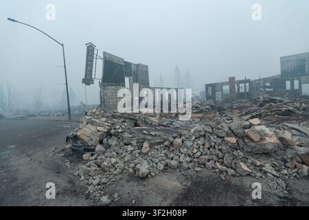 The Pioneer Cafe rests in smoke in downtown Greenville, CA on August 6th, 2021 after the Dixie Fire destroyed the town. Stock Photo